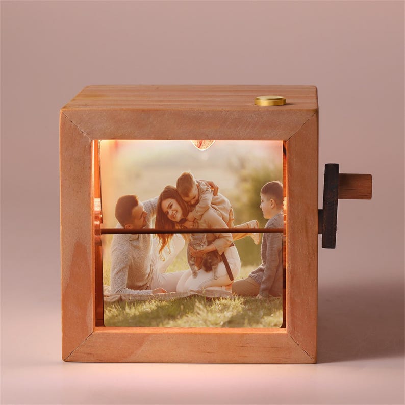 Phomora flip box album showcasing family and love memories